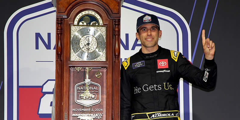 Aric Almirola celebrates in victory lane