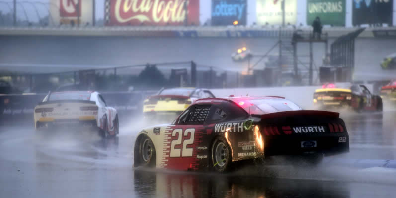 Austin Cindric drives in the rain at Charlotte Motor Speedway