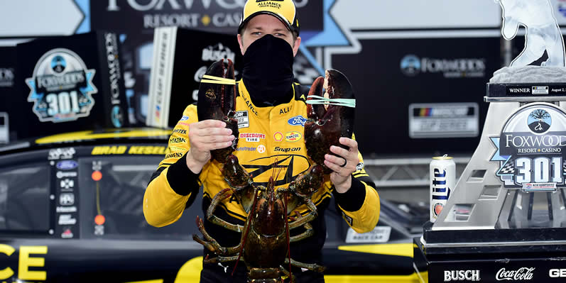 Brad Keselowski poses for a photo with Loudon the Lobster