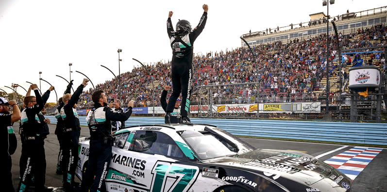 Chris Buescher celebrates after winning