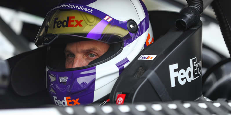 Denny Hamlin sits in his car during qualifying
