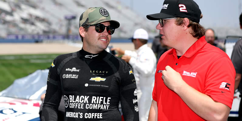 Noah Gragson and Sheldon Creed talk on the grid during qualifying