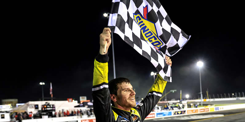Grant Enfinger celebrates with the checkered flag