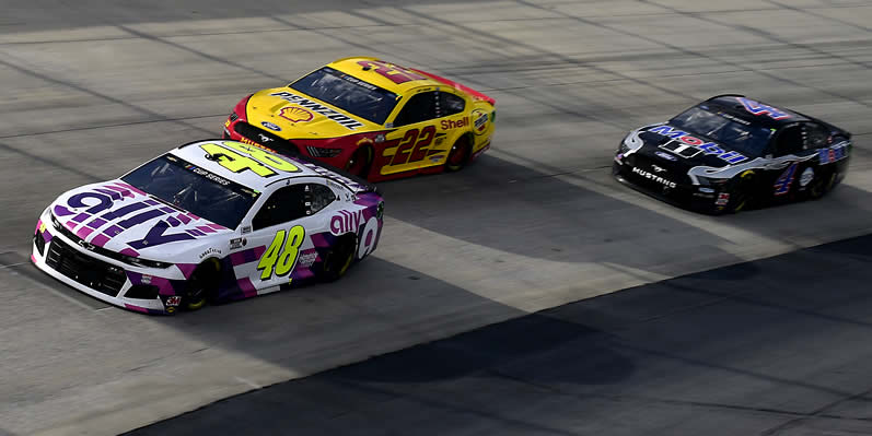 Jimmie Johnson leads Joey Logano and Kevin Harvick