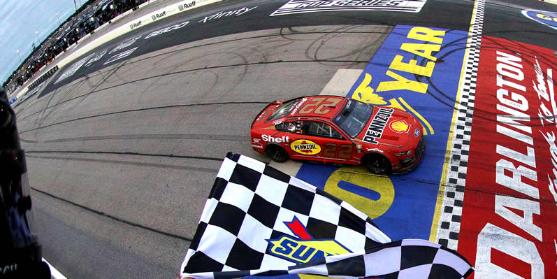 Joey Logano takes the checkered flag to win