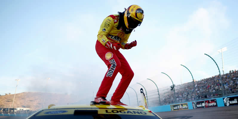 Joey Logano celebrates after winning