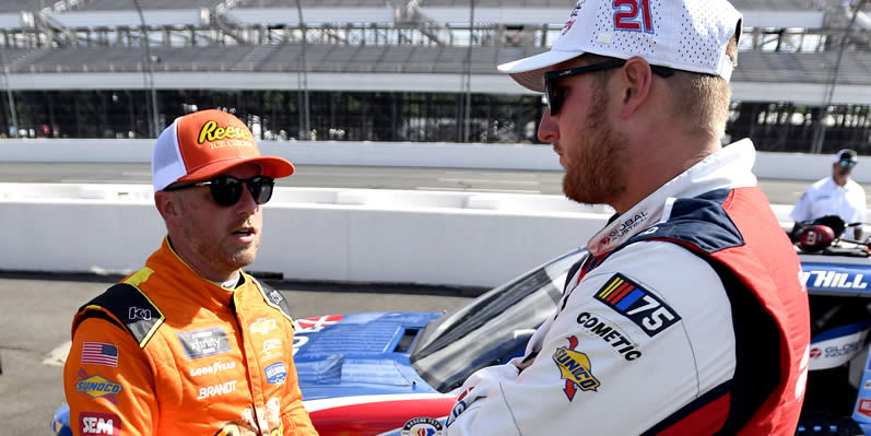 Justin Allgaier and Austin Hill talk on the grid during practice