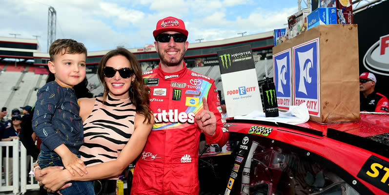 Kyle Busch celebrates with his wife Samantha and their son Brexton in Victory Lane