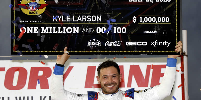 Kyle Larson celebrates with the one million dollar check