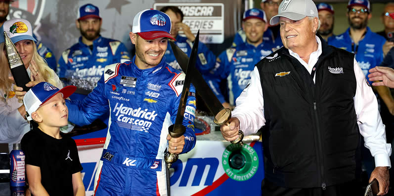 Rick Hendrick celebrates with Kyle Larson in victory lane