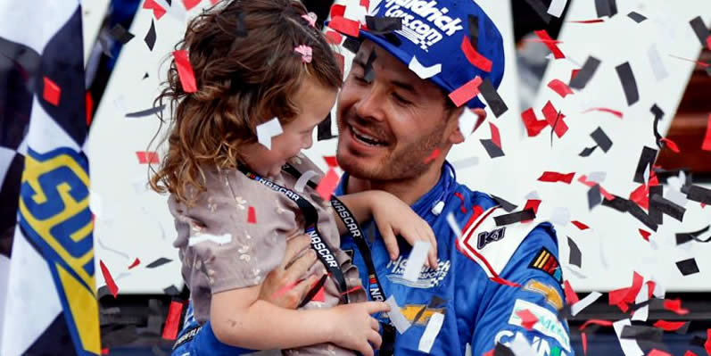 Kyle Larson celebrates with his daughter Audrey in Victory Lane