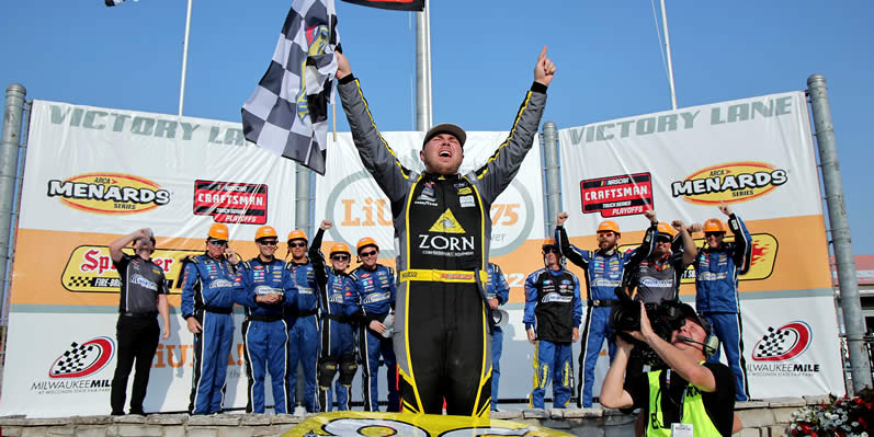 Layne Riggs celebrates in victory lane