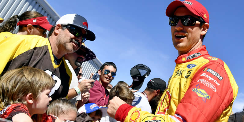  Joey Logano signs autographs for fans