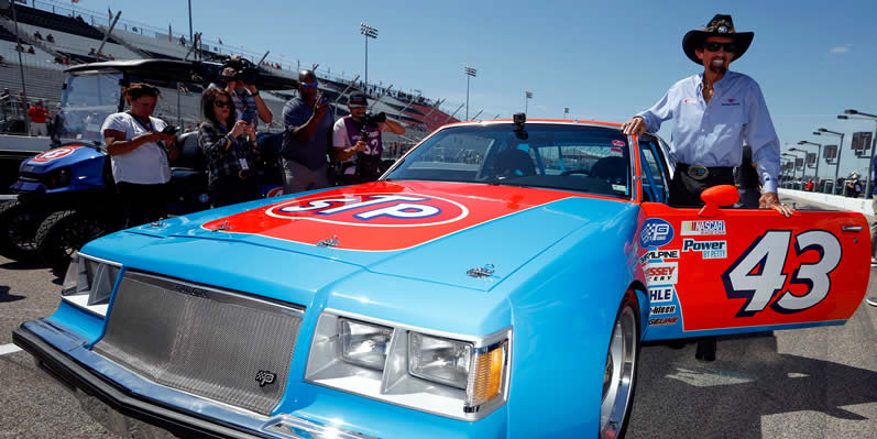 NASCAR Hall of Famer Richard Petty prepares to drive a replica of his #43 STP Pontiac
