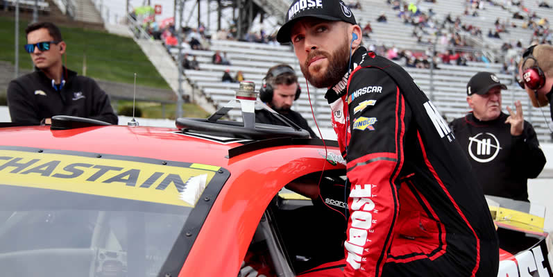 Ross Chastain enters his car during qualifying
