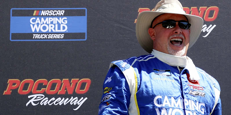 Todd Bodine laughs onstage during pre-race ceremonies