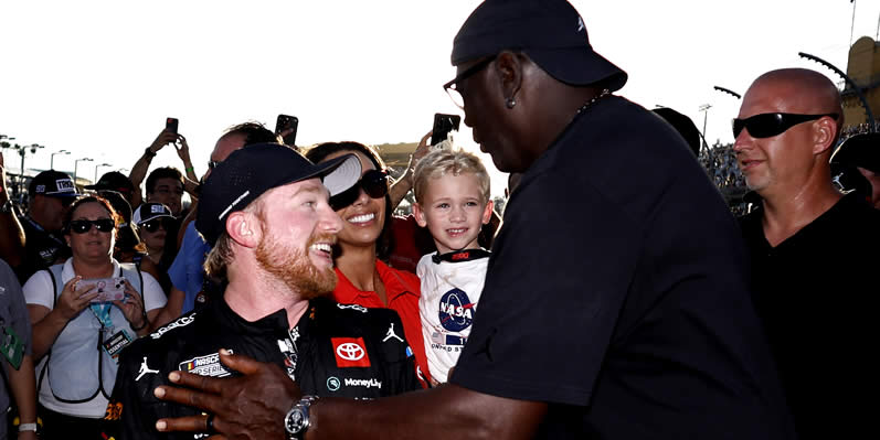 Michael Jordan and Tyler Reddick celebrate after winning