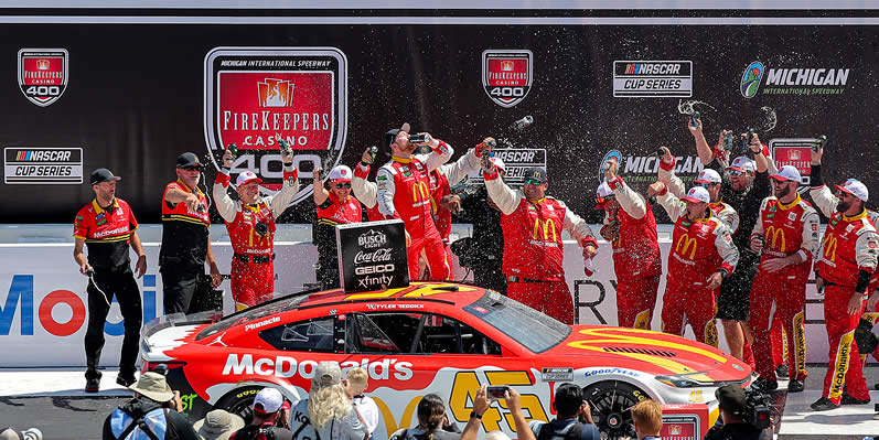 Tyler Reddick celebrates in victory lane