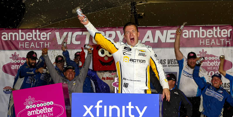 AJ Allmendinger celebrates in victory lane