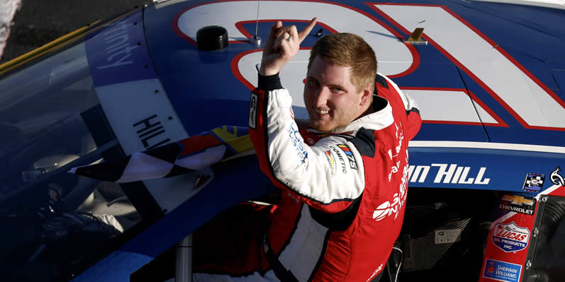 Austin Hill celebrates after winning