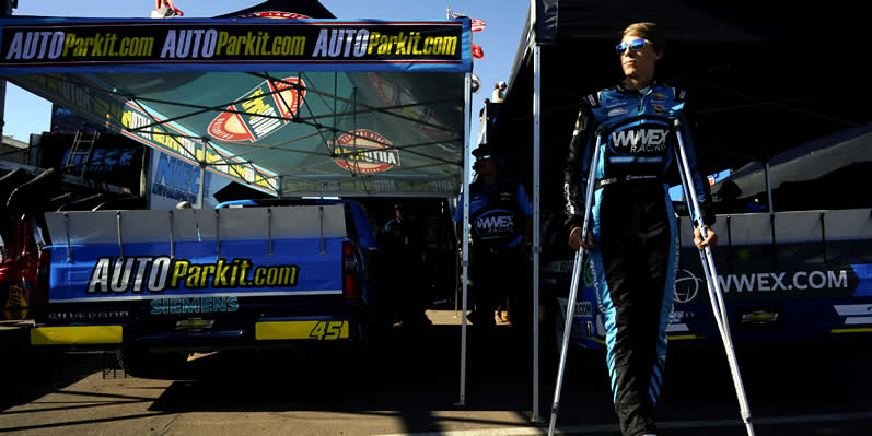  Carson Hocevar waits on crutches in the pit