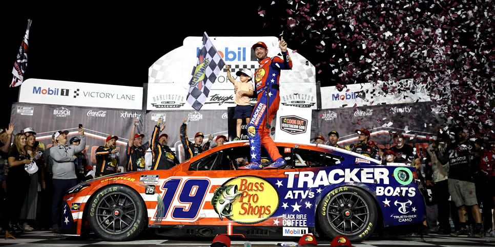 Chase Briscoe, celebrates with his son in victory lane after winning