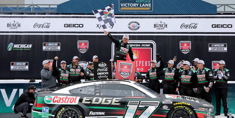 Chris Buescher waves the checkered flag in victory lane