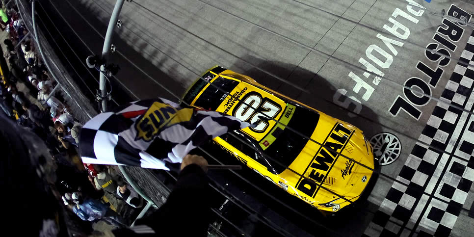 Christopher Bell takes the checkered flag to win the Bass Pro Shops Night Race