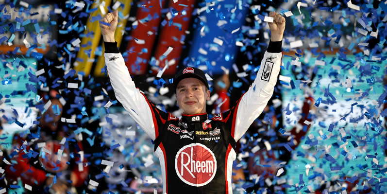 Christopher Bell celebrates in victory lane after winning