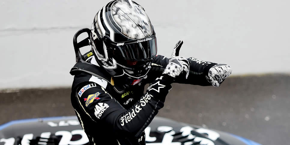 Corey Heim celebrates after winning the Brickyard 400
