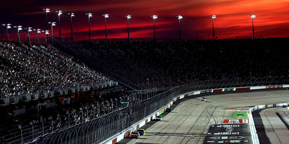 A general view of racing as the sun sets at Darlington Raceway
