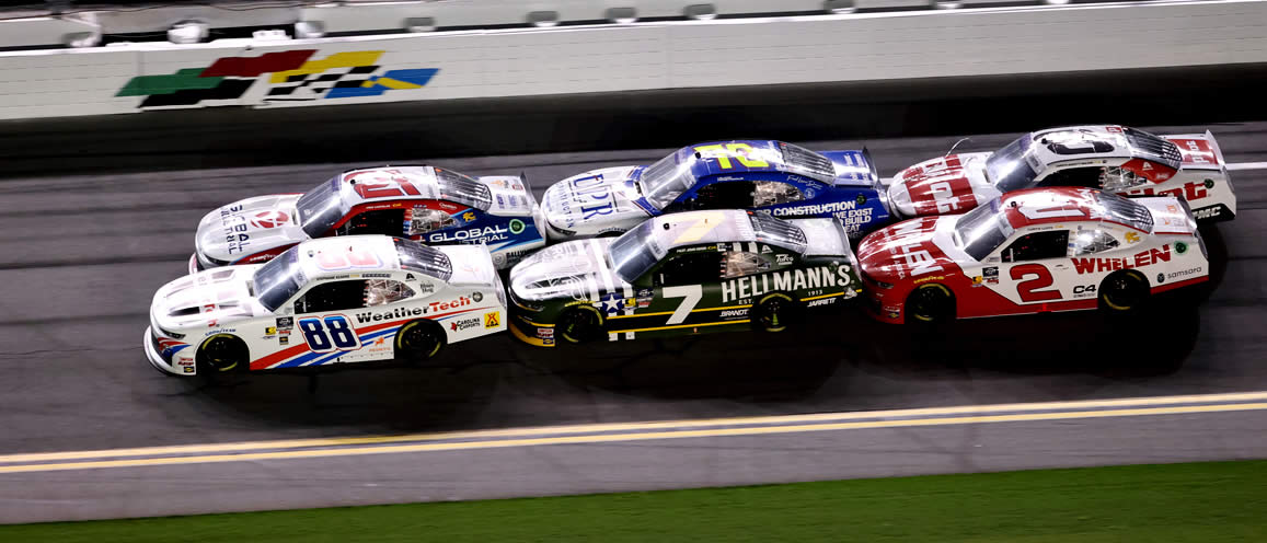 Parker Kligerman and Austin Hill lead the field on a restart at Daytona International Speedway