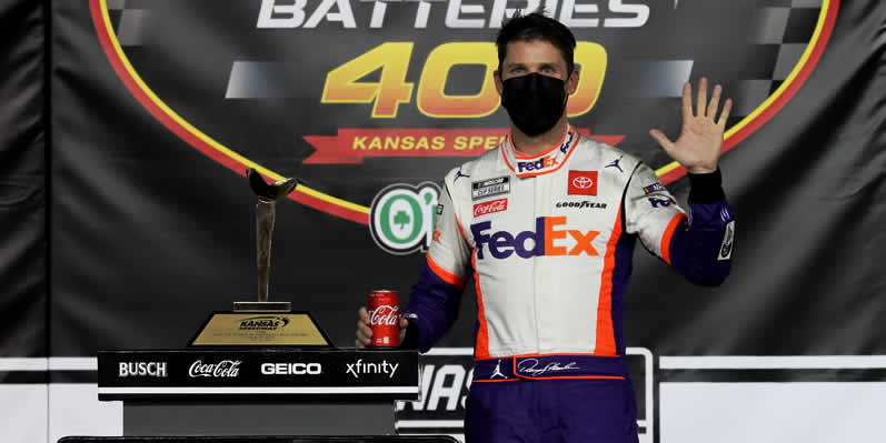 Denny Hamlin celebrates in Victory Lane