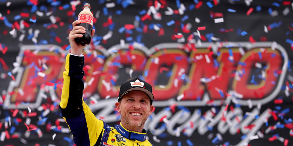 Denny Hamlin celebrates winning