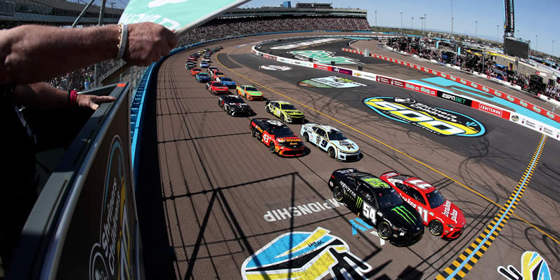 Denny Hamlin leads the field to the green flag