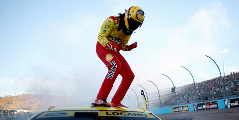 Joey Logano celebrates after winning