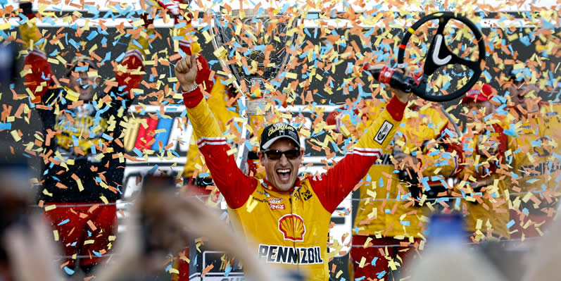 Joey Logano celebrates in victory lane