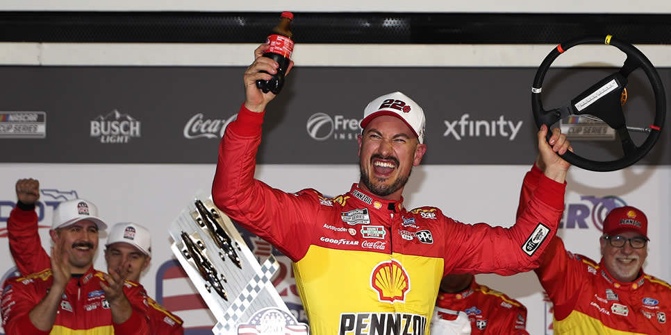Joey Logano celebrates in victory lane