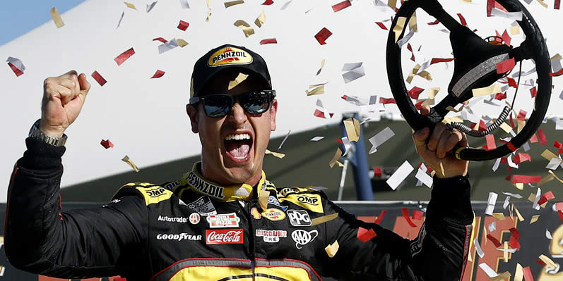 Joey Logano celebrates in victory lane