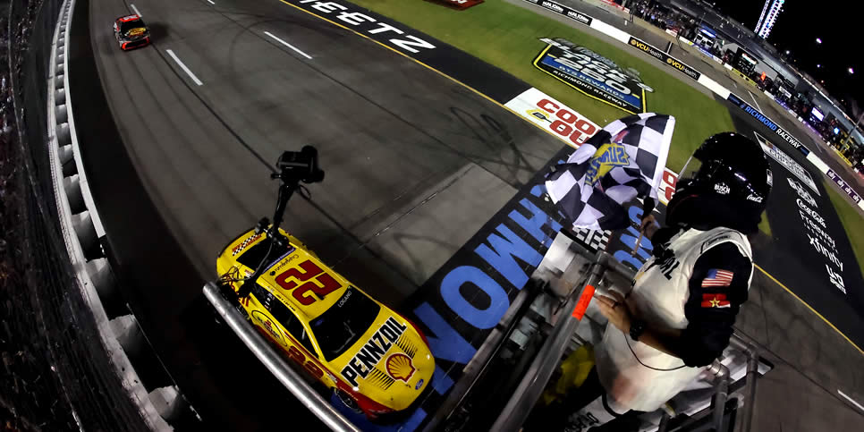 Joey Logano takes the checkered flag to win