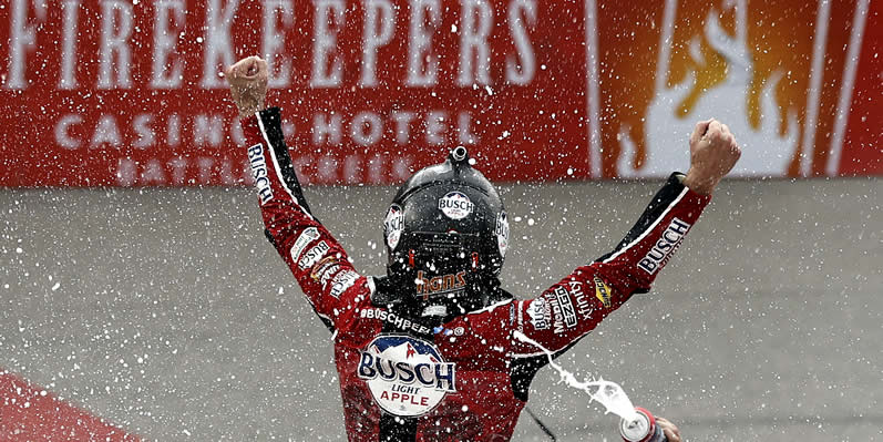 Kevin Harvick celebrates after winning