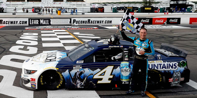 Kevin Harvick celebrates after wining