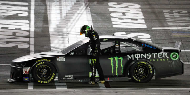 Kurt Busch celebrates after winning