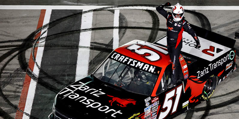 Kyle Busch celebrates after winning