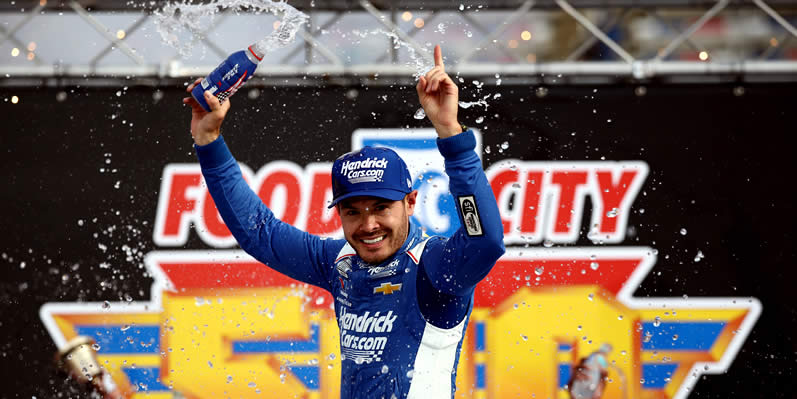Kyle Larson celebrates in victory lane