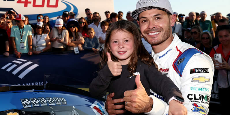 Kyle Larson and daughter pose in victory lane