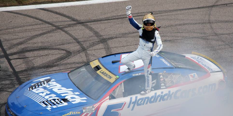 Kyle Larson celebrates after winning the Hollywood Casino 400