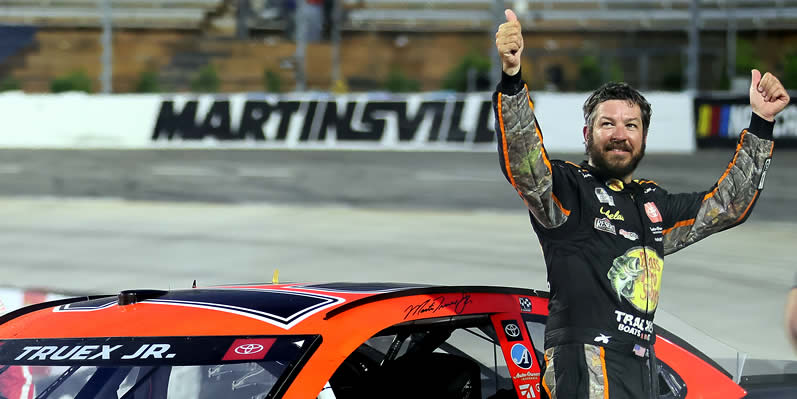 Martin Truex Jr celebrates winning