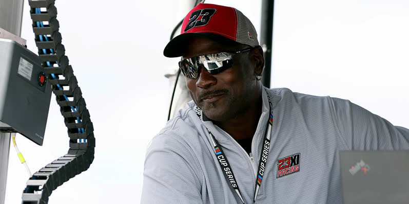 Michael Jordan looks on from the 23XI Racing pit box