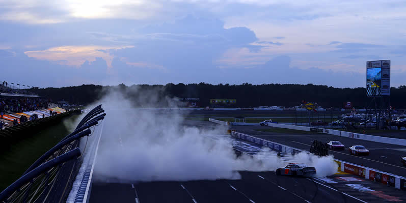 Noah Gragson celebrates with a burnout